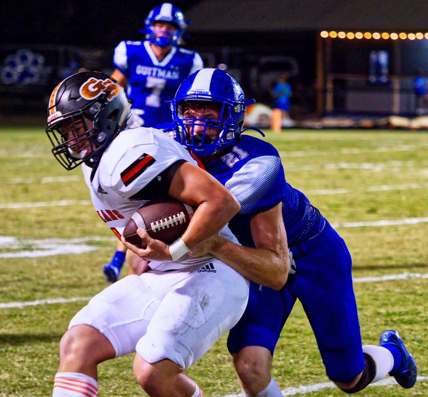 Cason Johnson forces the Indian ballcarrier to the boundary. [find more football photos]